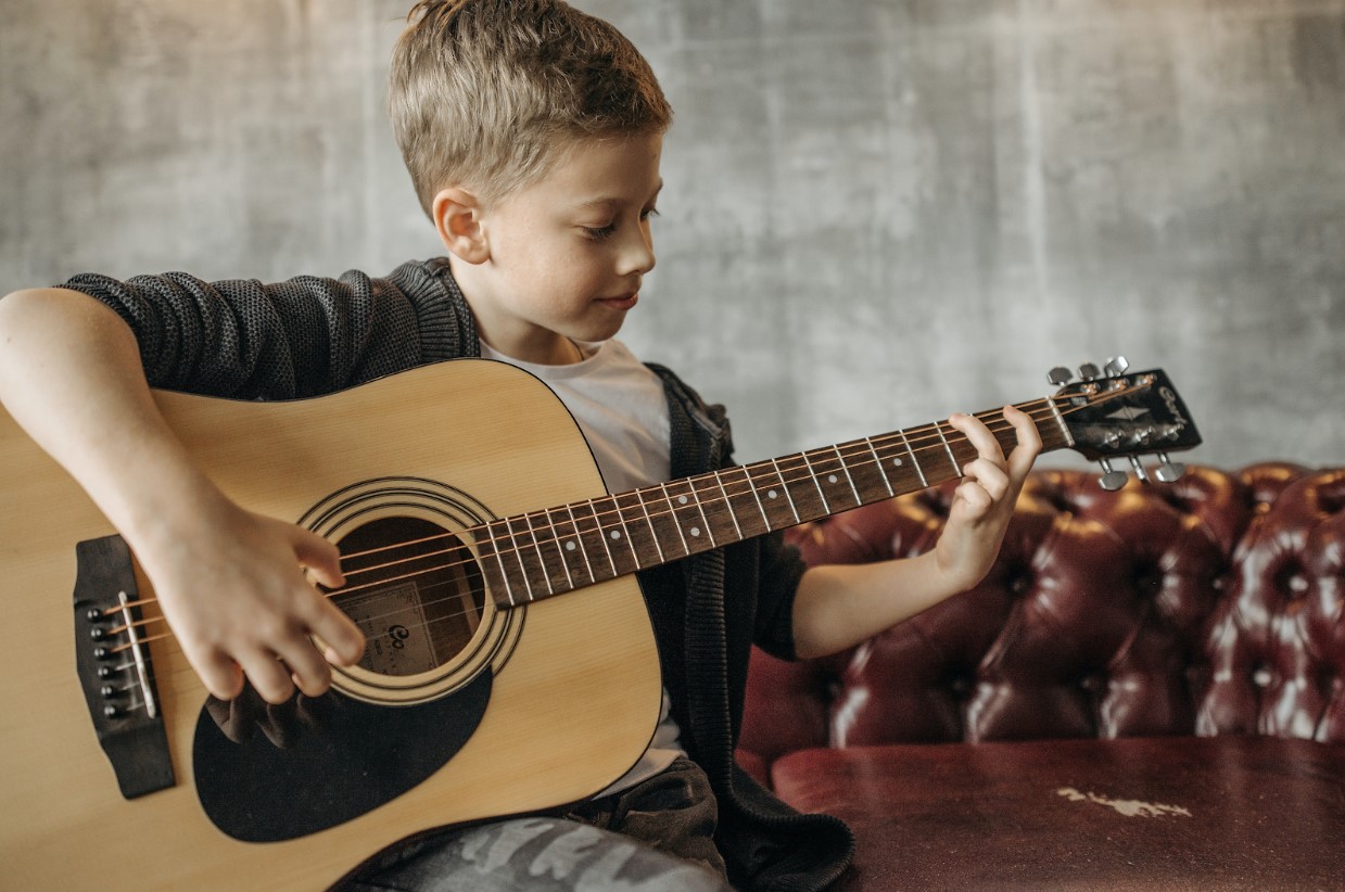 a boy playing guitar
