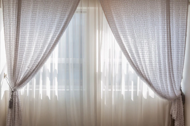 Stylish curtains in a well-decorated room