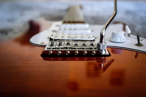 Close up of the strings on an electric guitar