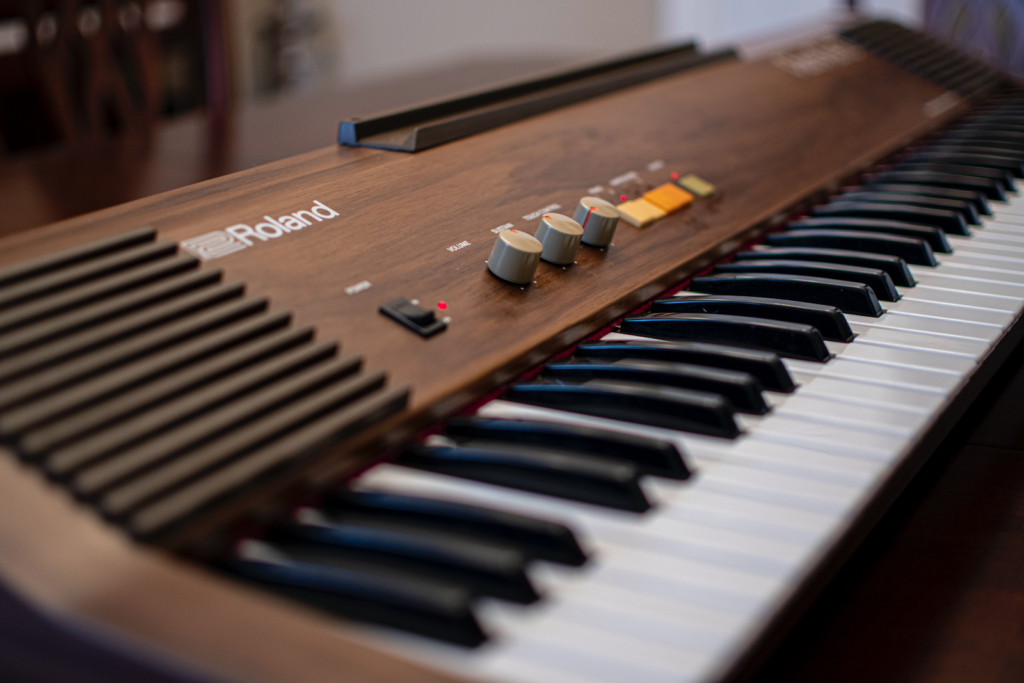 A close up of a Roland keyboard.