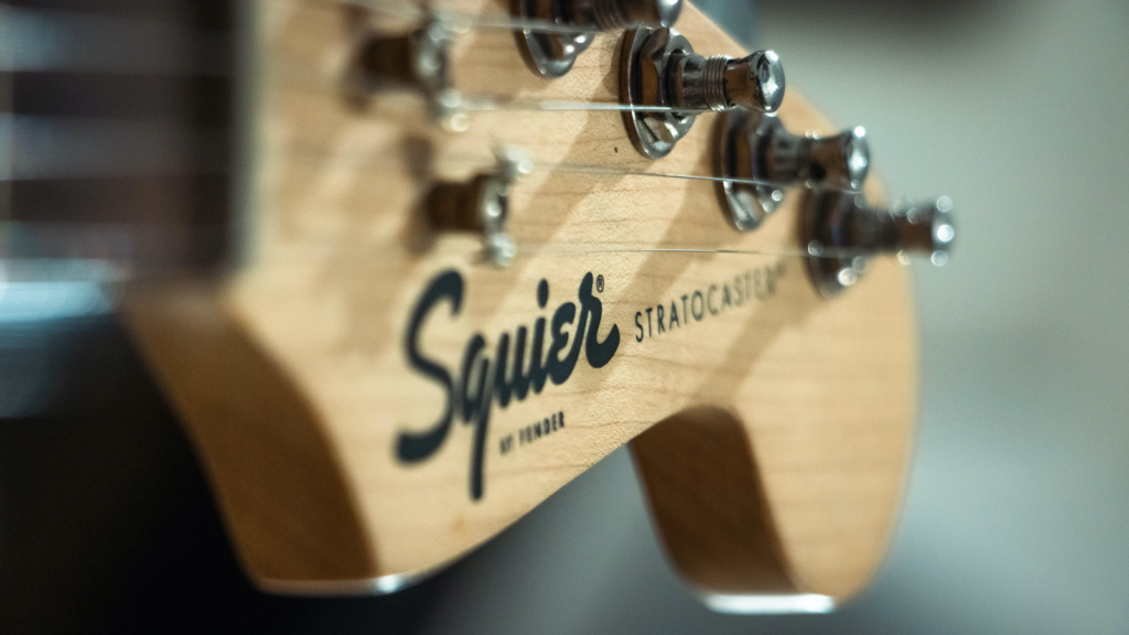 A Squier guitar headstock.