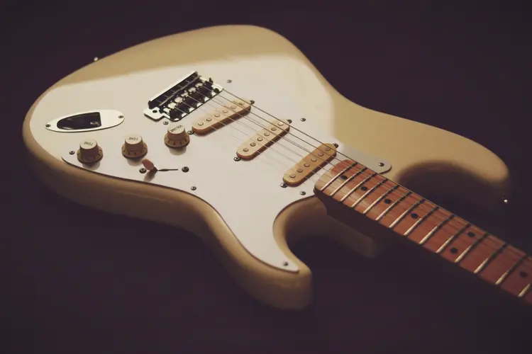 A white Stratocaster guitar.