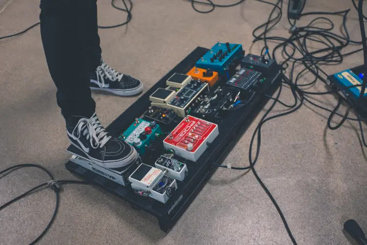 A set of effects pedals being used.