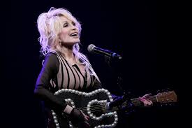 Dolly Parton performing on stage.