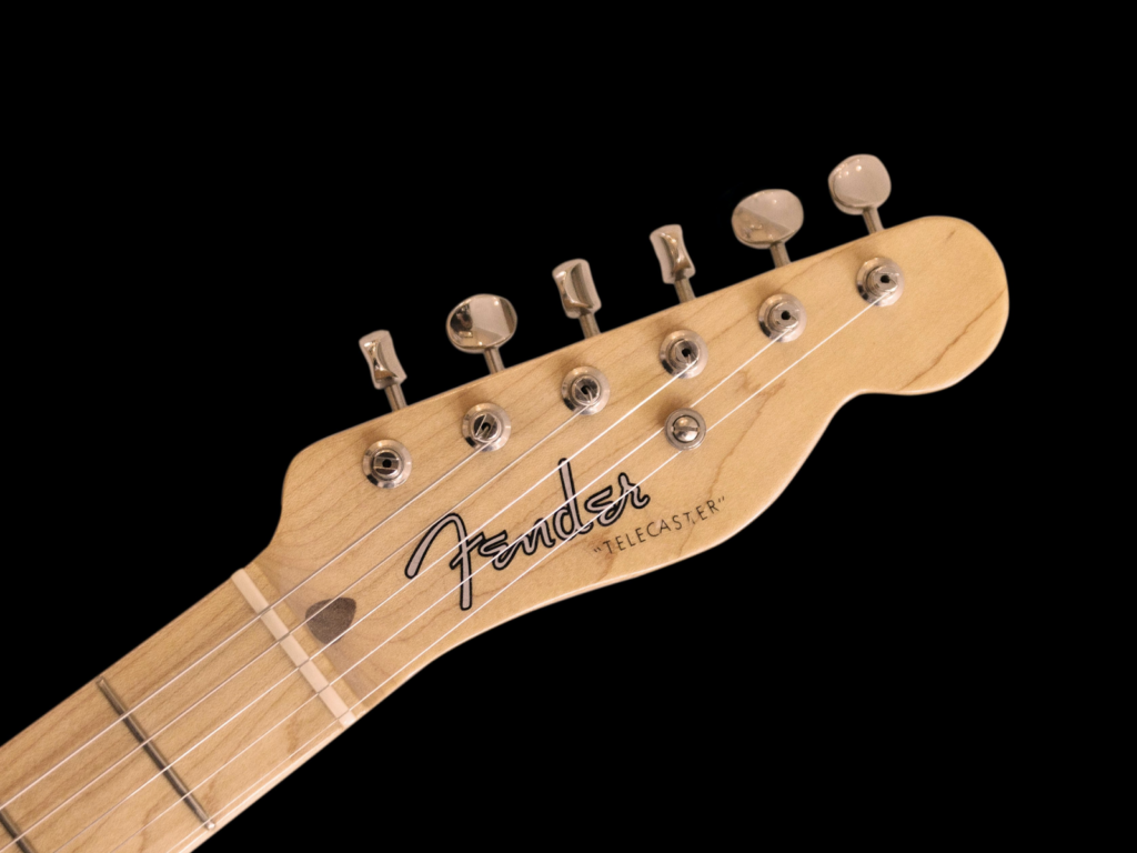 The Headstock of a Fender guitar.