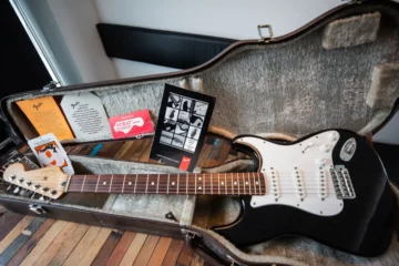An electric guitar in its guitar case.