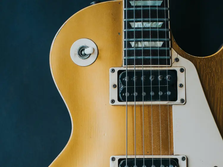 A close up of an electric guitar.
