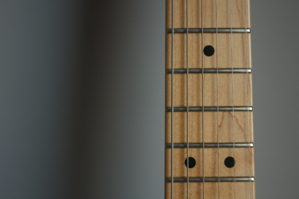 The fretboard of a guitar.