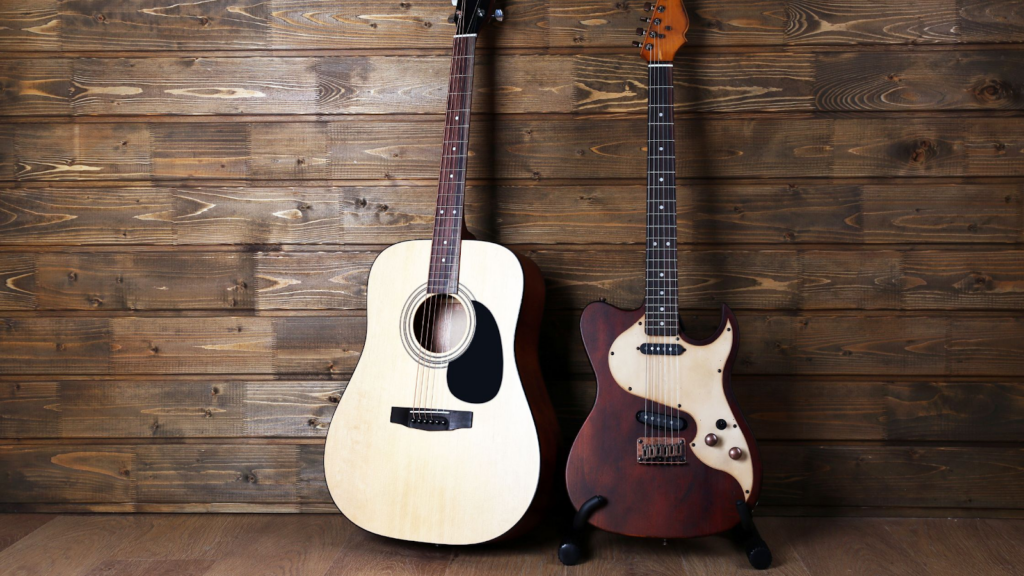 An acoustic guitar and an electric guitar standing upright, side by side.