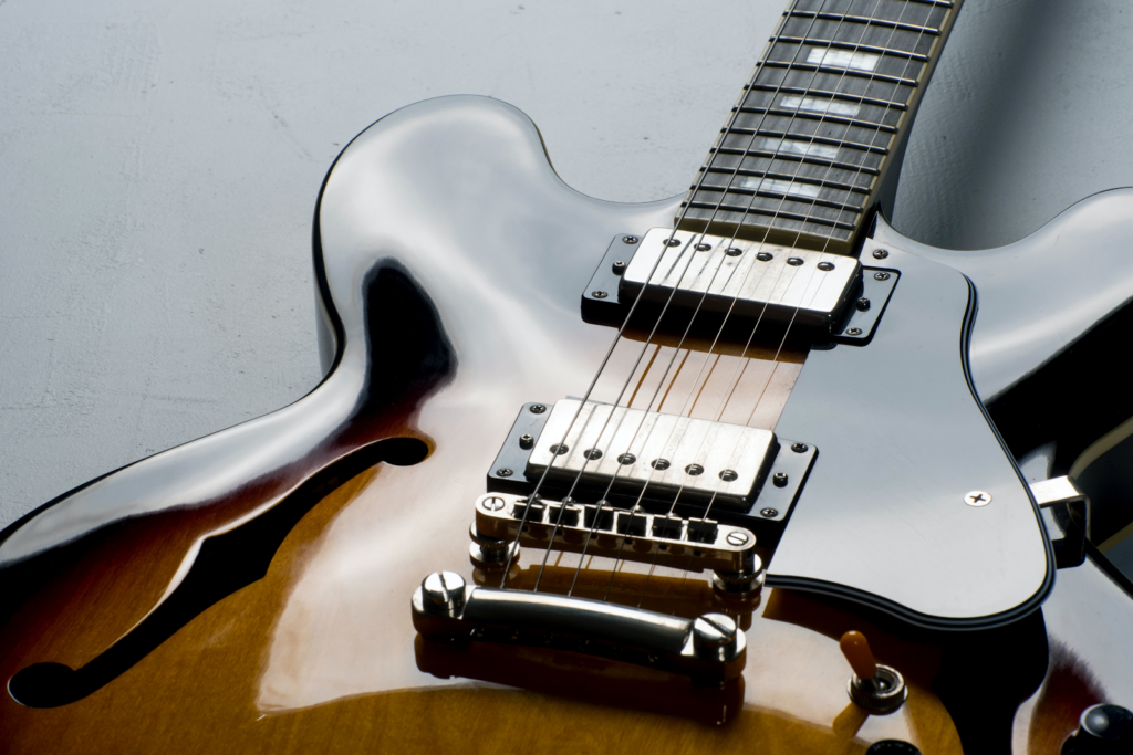 A close up of a beautifully polished electric guitar.