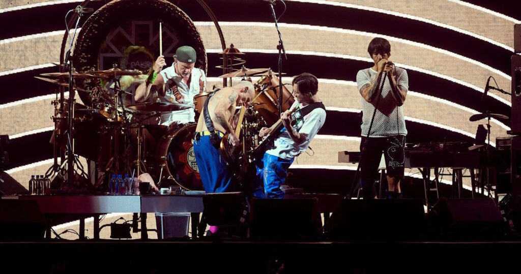 The Red Hot Chili Peppers performing on stage.