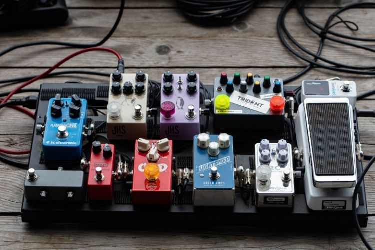 Various guitar pedals arranged neatly.