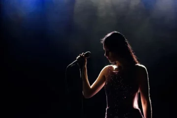 A singer on stage in the dark