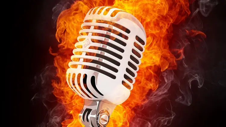 A microphone with flames in the background.