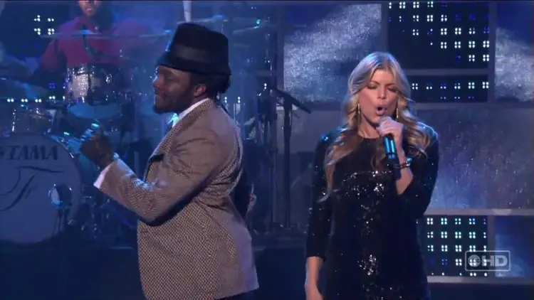 Fergie performing on stage with Will.i.am