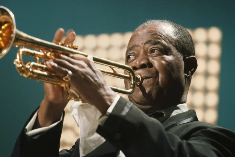 Louis Armstrong playing his trumpet.