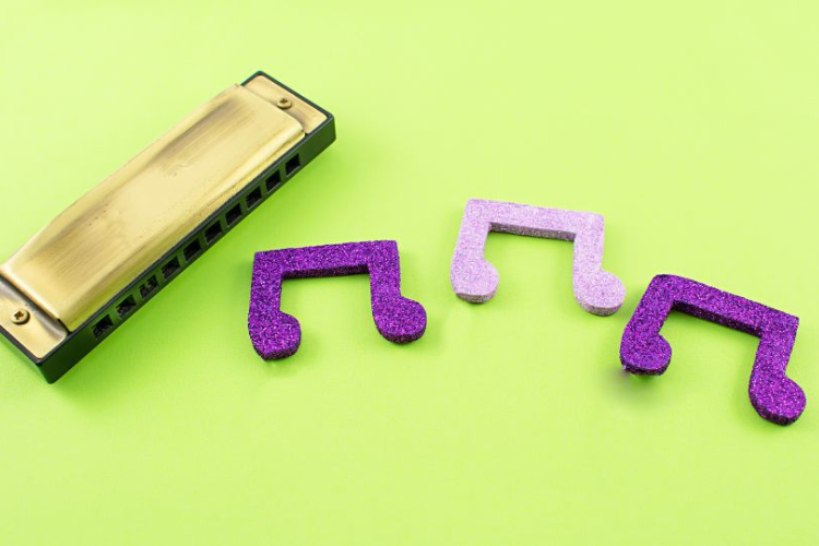 A harmonica with musical notes.