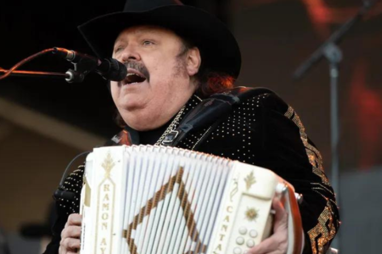Ramon Ayala performs on stage with his accordian.